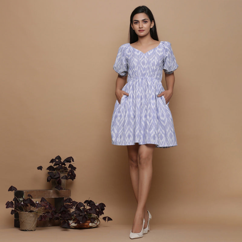 Front View of a Model wearing Powder Blue Ikat Elasticated Gathered Dress
