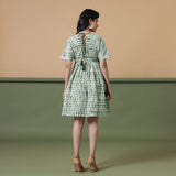 Back View of a Model wearing Forest Green Shibori Tie-Dye Cotton Knee Length Dress
