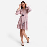 Front View of a Model wearing Pink Crinkled Cotton Fit and Flare Dress