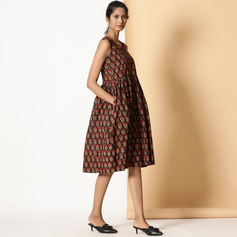 Right View of a Model wearing Floral Block Printed Gathered Knee Length Cotton Dress