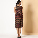 Back View of a Model wearing Floral Block Printed Gathered Knee Length Cotton Dress