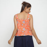 Back View of a Model wearing Orange Floral Block Printed Square Neck Cotton Top