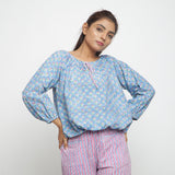 Front View of a Model wearing Blue Floral Block Printed Balloon Cotton Top