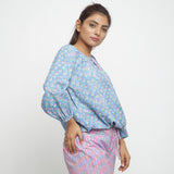 Right View of a Model wearing Blue Floral Block Printed Balloon Cotton Top