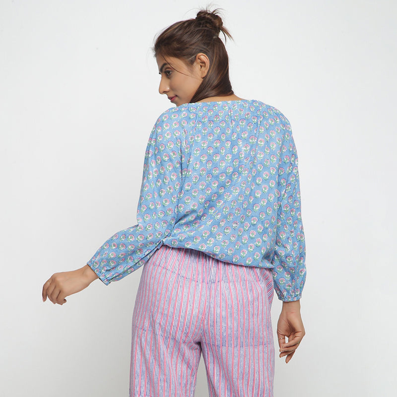 Back View of a Model wearing Blue Floral Block Printed Balloon Cotton Top
