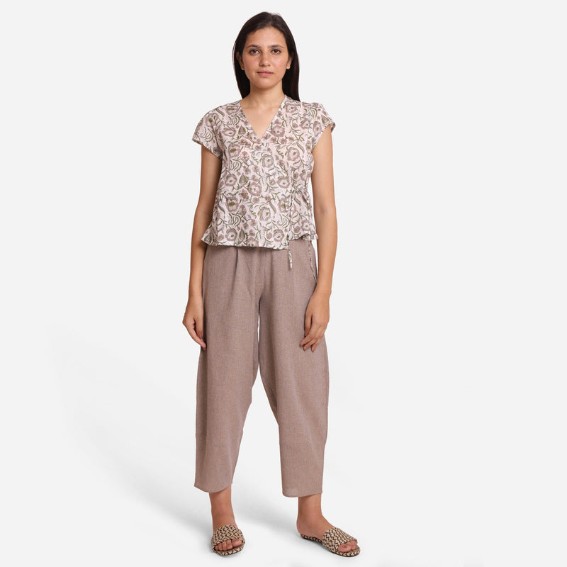 Front View of a Model wearing Floral Print Casual Top and Beige Pant Set
