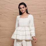Front View of a Model Wearing Undyed Peplum Jute Lace Gathered Top