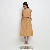 Front View of a Model Wearing Minimal Handspun Rust Top and Skirt Set
