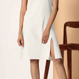 Front Detail of a Model wearing Frosted White Cotton Flax Strappy Slit Dress