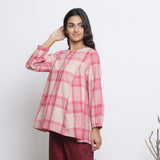 Left View of a Model wearing Fuchsia and Pink Checkered Flared Top