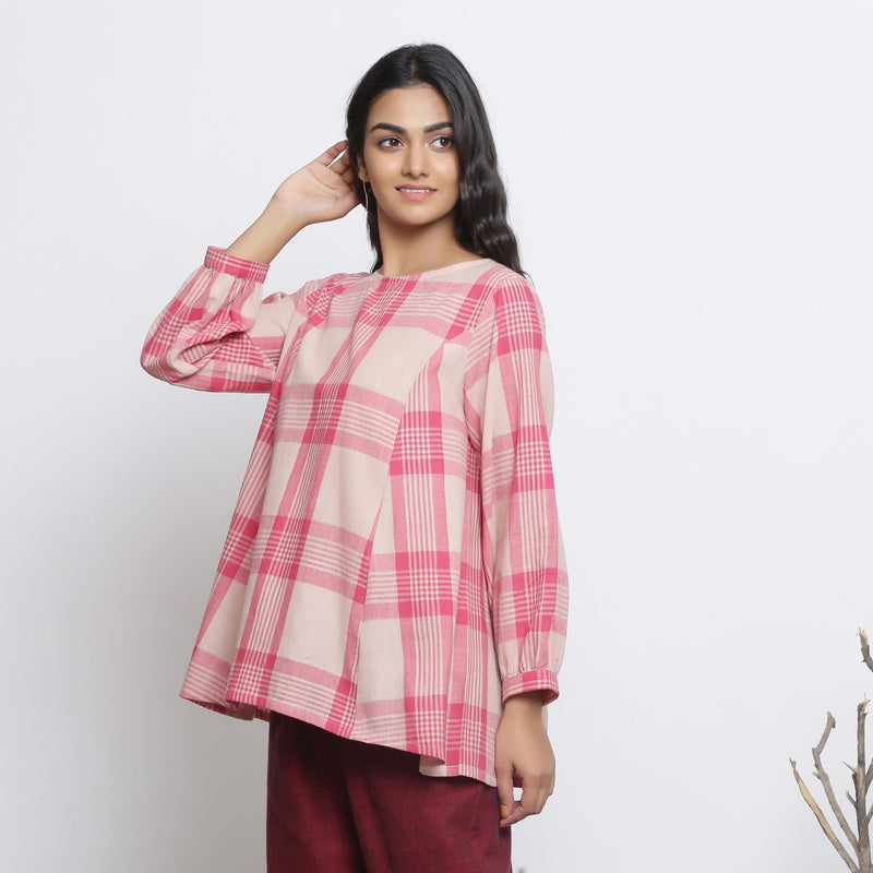Left View of a Model wearing Fuchsia and Pink Checkered Flared Top