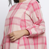 Front Detail of a Model wearing Fuchsia and Pink Checkered Flared Top