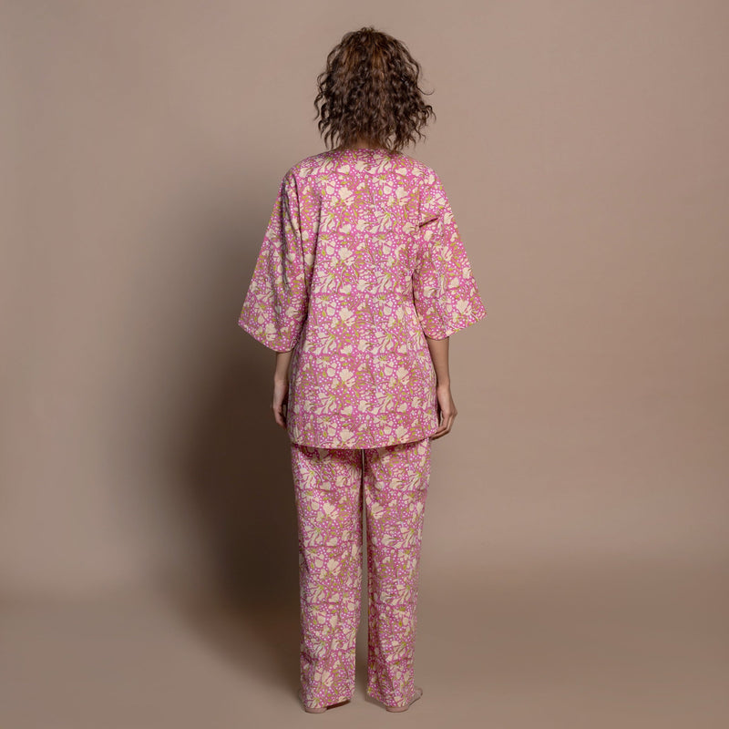 Back View of a Model wearing Fuchsia Floral Block Print Cotton Straight Pant