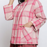 Left Detail of a Model wearing Pink Checkered Handspun Cotton Outerwear