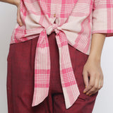 Front Detail of a Model wearing Fuchsia and Pink Tie Up Button-Down Top