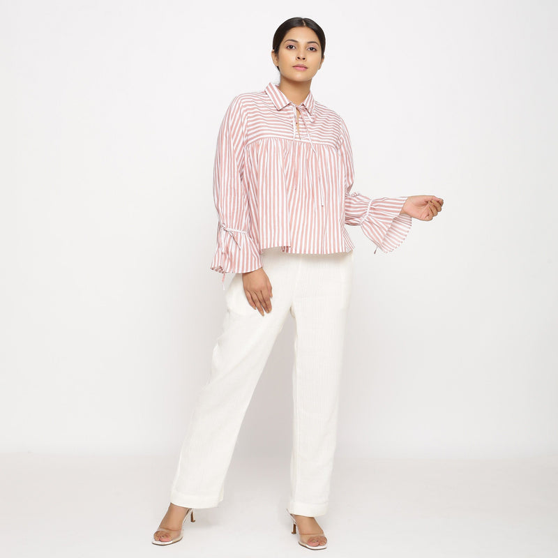 Front View of a Model wearing Gathered Top and Off-White Tapered Pant Set