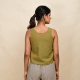Back View of a Model wearing Gold Green 100% Cotton Sleeveless Short Top