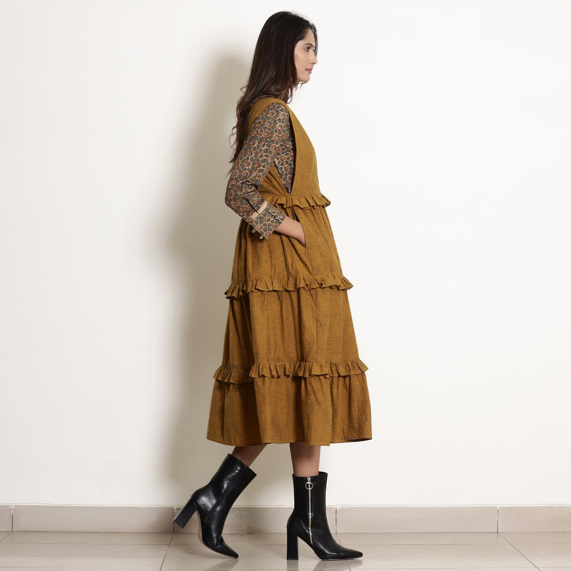 Right View of a Model wearing Golden Oak Tier Pinafore Frilled Dress