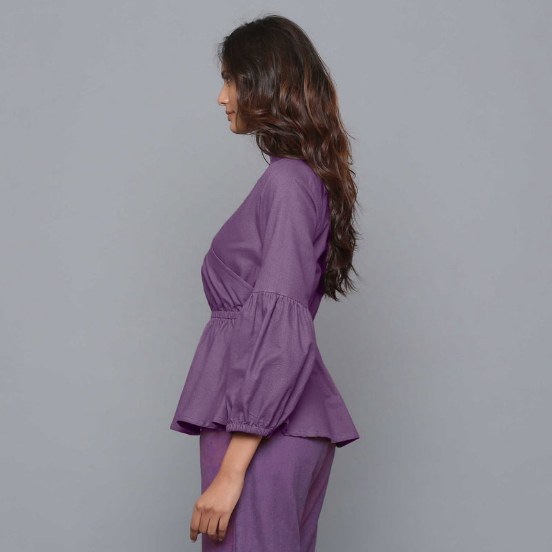 Left View of a Model wearing Grape Wine V-Neck Flannel Peplum Top