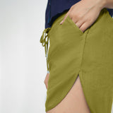 Left Detail of a Model wearing Green 100% Cotton Low-Rise Short Shorts