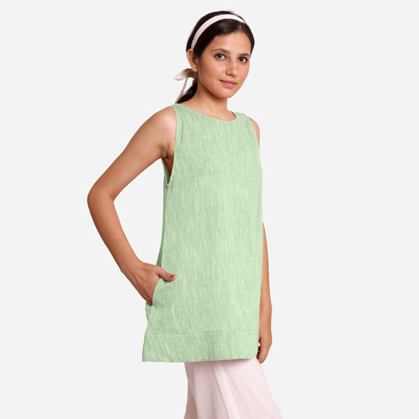 Right View of a Model wearing Green 100% Cotton Sleeveless Mini Tunic