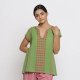 Front View of a Model wearing Green And Red Yarn Dyed A-Line Top
