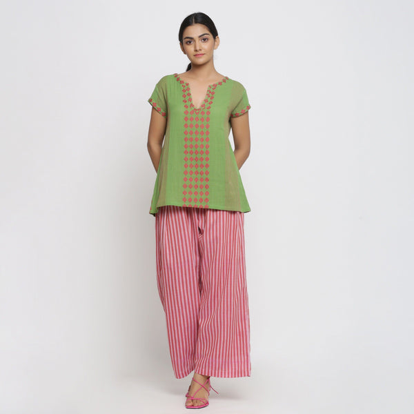 Front View of a Model wearing Green And Red Yarn Dyed A-Line Top