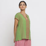 Right View of a Model wearing Green And Red Yarn Dyed A-Line Top
