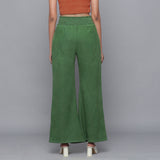 Back View of a Model wearing Green Corduroy Striped Bootcut Pant