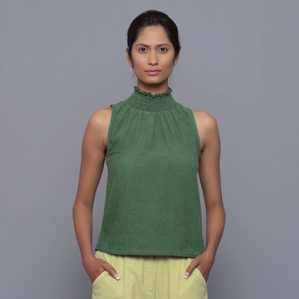 Front View of a Model wearing Green Cotton Corduroy High Neck Top