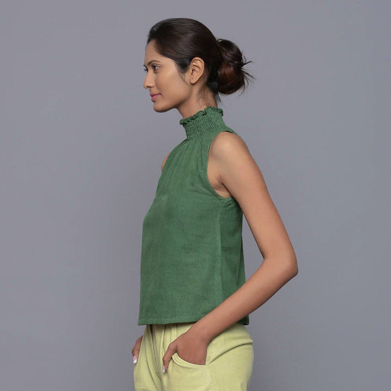 Left View of a Model wearing Green Cotton Corduroy High Neck Top