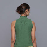 Back View of a Model wearing Green Cotton Corduroy High Neck Top