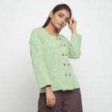 Right View of a Model wearing Green Cotton Flax Button-Down Jacket