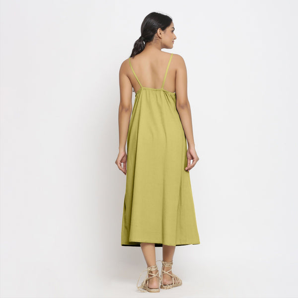 Back View of a Model wearing Green Cotton Flax Strap Sleeve A-Line Dress