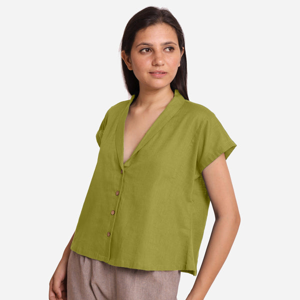 Left View of a Model wearing Green Deep Neck Button-Down Cotton Top