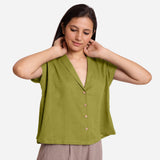 Front View of a Model wearing Green Deep Neck Button-Down Cotton Top