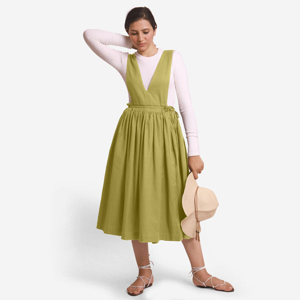 Front View of a Model wearing Green Deep Neck Pinafore Midi Wrap Dress