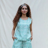 Front View of a Model wearing Green Floral Block Printed Cotton Sleeveless Top