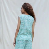 Back View of a Model wearing Green Floral Block Printed Cotton Sleeveless Top