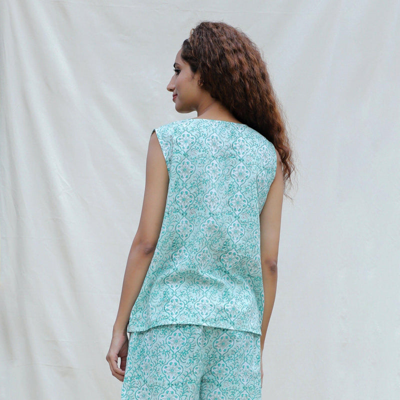Back View of a Model wearing Green Floral Block Printed Cotton Sleeveless Top