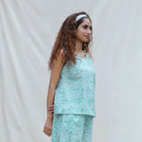 Right View of a Model wearing Green Floral Block Printed Cotton Sleeveless Top