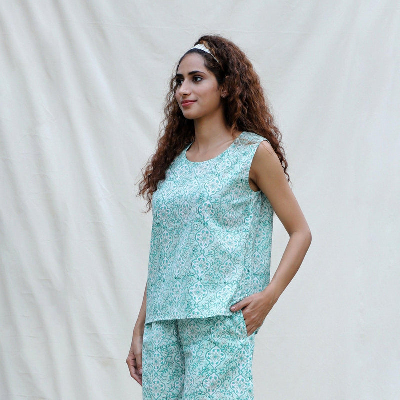 Left View of a Model wearing Green Floral Block Printed Cotton Sleeveless Top