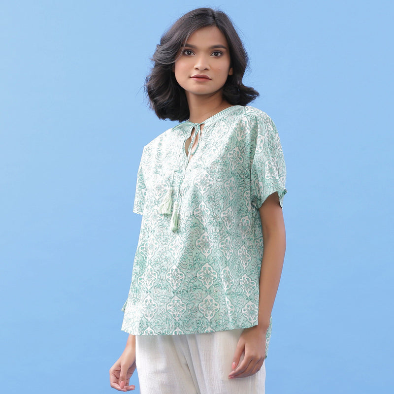 Left View of a Model wearing Green Hand Block Printed A-Line Cotton Top