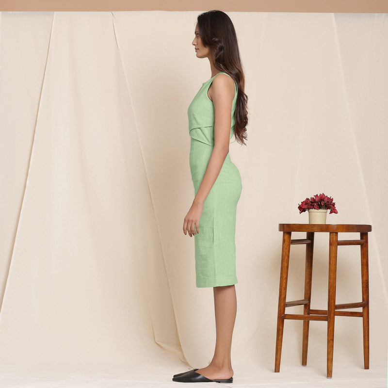 Left View of a Model wearing Green Knee Length Cotton Sheath Dress