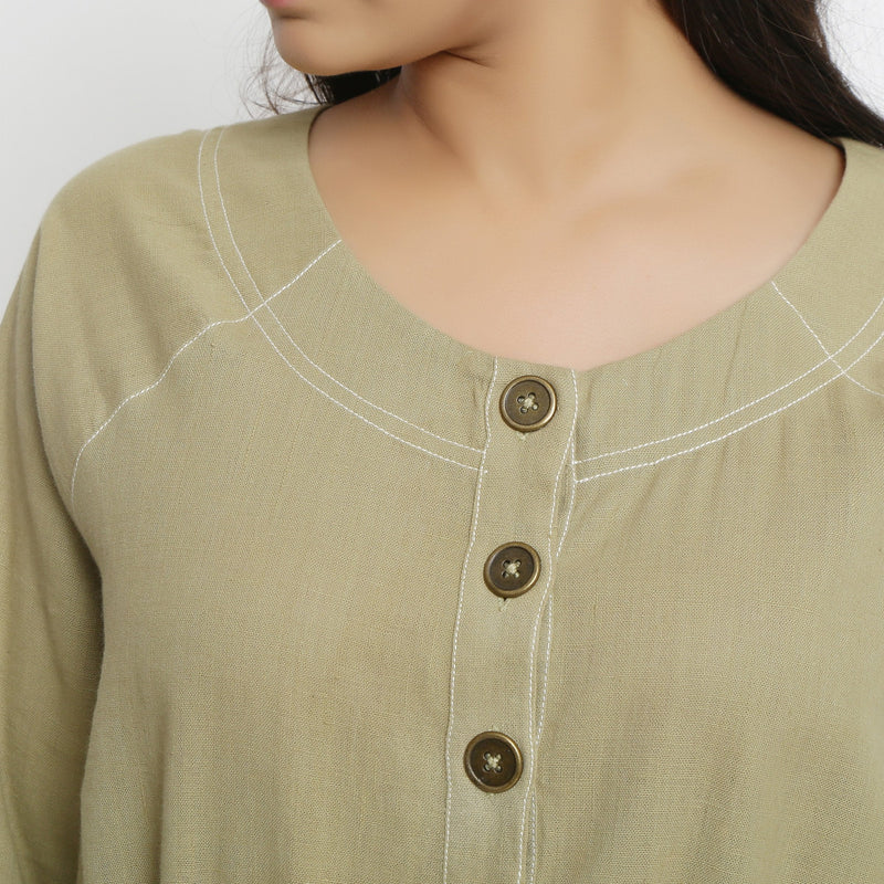 Front Detail of a Model wearing Green Vegetable Dyed Handspun Cotton Round Neck Button-Down Midi Dress