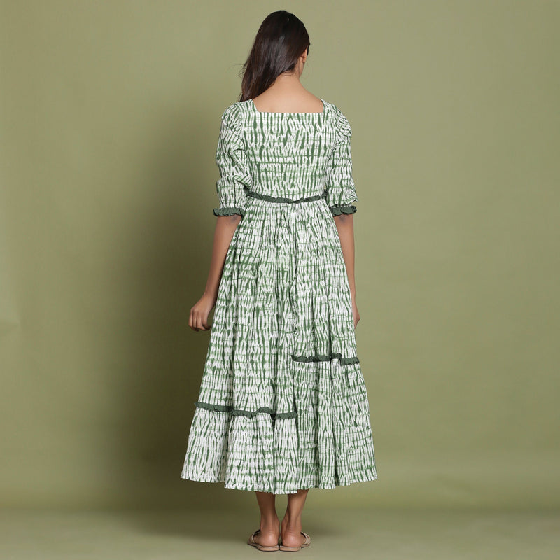 Back View of a Model wearing Green Shibori Asymmetrical Tier Maxi Dress