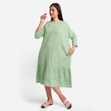 Front View of a Model wearing Green Yarn-Dyed 100% Cotton Tier Midi Dress