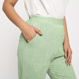Front Detail of a Model wearing Green Yarn Dyed Mid Rise Tapered Pant