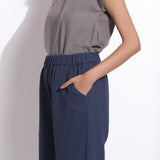 Left Detail of a Model wearing Grey Essential Top and Navy Blue Pant Set