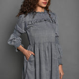 Front Detail of a Model wearing Slate Grey Handspun Cotton Knee Length Frilled Peasant Dress